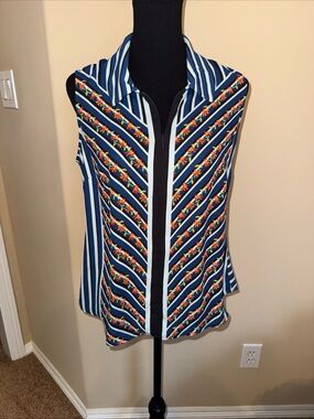 Cabi Multi colored blue top size Small. Like new.